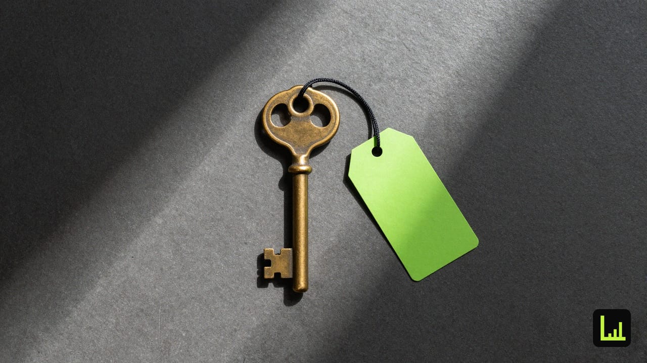 A vintage brass key on dark concrete with a lime-green tag, the question of whether to keep your Drift seat.
